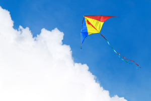A kite flying in a cloudy sky.