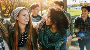 Teenager, walking and talking with friends in park, nature or social group outdoor together with funny conversation. Happy, teen and kids laugh at joke with best friend in community or relax in fall. A Data Infrastructure Roadmap for Preventing Youth Homelessness